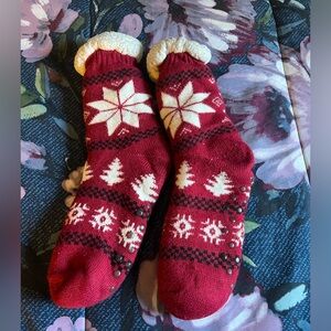 Red Christmas fuzzy socks with no slick bottoms. Used but in good condition.